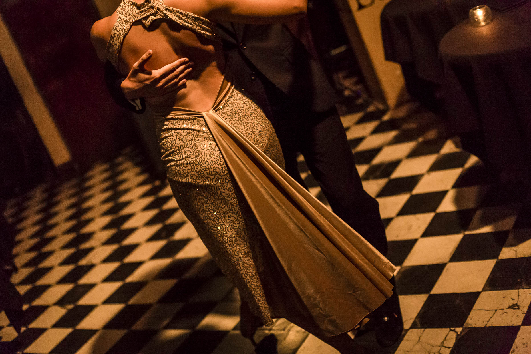 Tango dancers embrase on dance floor