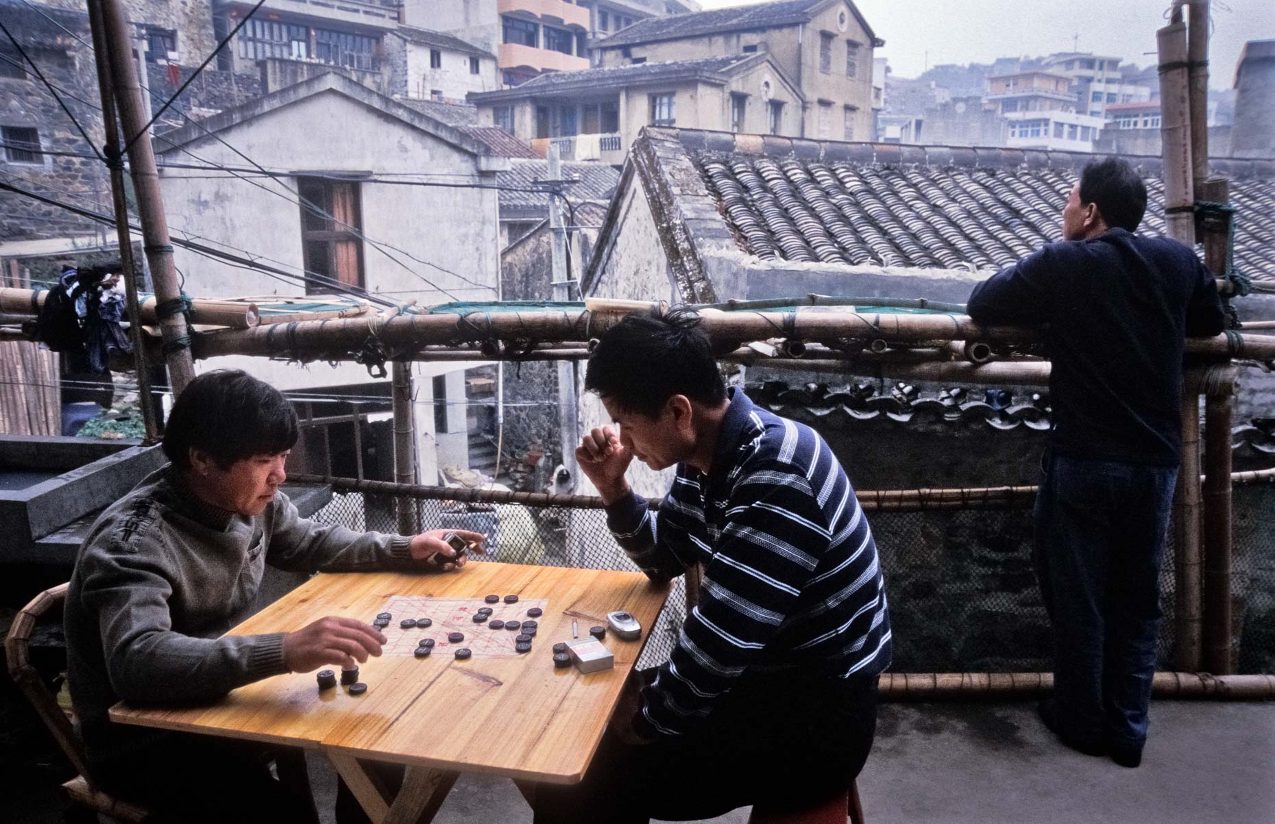 Two men play Chinese chess